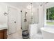 Elegant bathroom with a glass shower and vanity at 9545 Kingston Crossing Cir, Alpharetta, GA 30022