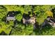 Aerial view of a lovely house nestled amongst lush greenery and mature trees, providing privacy at 11950 Wildwood Springs Dr, Roswell, GA 30075