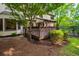 Beautiful back deck surrounded by lush greenery, offering a private outdoor space at 11950 Wildwood Springs Dr, Roswell, GA 30075