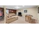 Finished basement with carpet flooring, entertainment center, a wet bar and recreational games at 11950 Wildwood Springs Dr, Roswell, GA 30075