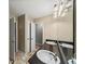 Bathroom showcasing a dual sink vanity with a dark granite countertop at 11950 Wildwood Springs Dr, Roswell, GA 30075