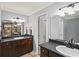 Bathroom with granite countertops, double sinks, and modern fixtures and tiling at 11950 Wildwood Springs Dr, Roswell, GA 30075