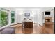 Bright office space with hardwood floors, bay window, and stone fireplace view at 11950 Wildwood Springs Dr, Roswell, GA 30075
