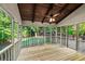 Charming screened-in porch with a wooden ceiling and views of the backyard at 11950 Wildwood Springs Dr, Roswell, GA 30075