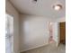 Cozy bedroom featuring neutral carpet, a window with blinds, and an open doorway at 4954 River Overlook Way, Lithonia, GA 30038