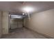 Spacious garage with an automatic door and concrete floor at 4954 River Overlook Way, Lithonia, GA 30038