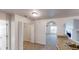 Hallway with archways and views into an open concept living and kitchen area at 4954 River Overlook Way, Lithonia, GA 30038