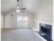 Inviting living room with vaulted ceilings, a fireplace, and carpet floors, creating a perfect space to relax at 4954 River Overlook Way, Lithonia, GA 30038