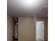 View of utility room featuring a water heater and doorway at 4954 River Overlook Way, Lithonia, GA 30038
