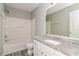 Bathroom features a white vanity with granite countertop, and shower at 5229 Kirk Dr, Atlanta, GA 30349