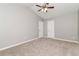 Spacious bedroom with a ceiling fan and ample closet space, ideal for relaxation at 5229 Kirk Dr, Atlanta, GA 30349