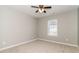 Bedroom with neutral carpet and walls, a window with blinds and a ceiling fan at 5229 Kirk Dr, Atlanta, GA 30349
