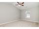 Serene bedroom with a vaulted ceiling, a ceiling fan, and a bright window at 5229 Kirk Dr, Atlanta, GA 30349