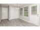 Bright dining area with natural light, featuring a chandelier and a closet at 5229 Kirk Dr, Atlanta, GA 30349