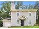 Charming two-story home with neutral siding, manicured lawn, and attached garage at 5229 Kirk Dr, Atlanta, GA 30349