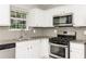 Well-equipped kitchen features granite countertops, stainless steel appliances, and subway tile backsplash at 5229 Kirk Dr, Atlanta, GA 30349