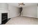 Spacious living room with a fireplace and staircase, perfect for Gathering gatherings at 5229 Kirk Dr, Atlanta, GA 30349