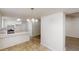 Open dining area next to the kitchen featuring modern chandelier at 6614 Biscayne Blvd, Rex, GA 30273