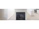 Living room fireplace with tile flooring and open view to kitchen with white countertops at 6614 Biscayne Blvd, Rex, GA 30273