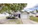 Charming single-story home with gray siding, attached garage, and a well-maintained front yard at 6614 Biscayne Blvd, Rex, GA 30273