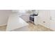 Bright kitchen with white countertops, stainless steel appliances, and access to the backyard at 6614 Biscayne Blvd, Rex, GA 30273