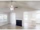 Open living space with fireplace and natural light overlooking the kitchen at 6614 Biscayne Blvd, Rex, GA 30273