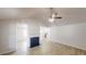 Bright living room featuring light wood floors, fireplace, and view into the kitchen at 6614 Biscayne Blvd, Rex, GA 30273