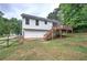 Exterior back view featuring a deck, yard and white siding at 70 Ashbury Ct, Dallas, GA 30157