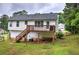 View of the backyard featuring a charming wood deck and a lush green lawn perfect for outdoor enjoyment and relaxation at 70 Ashbury Ct, Dallas, GA 30157