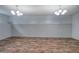 Finished basement has flooring and block walls with lighting at 70 Ashbury Ct, Dallas, GA 30157