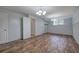 This basement boasts wood floors and a sliding barn door at 70 Ashbury Ct, Dallas, GA 30157