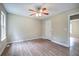 Spacious bedroom featuring wood flooring, ceiling fan, and neutral paint at 70 Ashbury Ct, Dallas, GA 30157