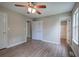 Bright bedroom with ceiling fan, wood flooring, and ensuite bath at 70 Ashbury Ct, Dallas, GA 30157