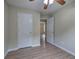 Bedroom features light wood flooring, a ceiling fan and neutral walls at 70 Ashbury Ct, Dallas, GA 30157