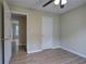 Bedroom shows light wood flooring and views into the house at 70 Ashbury Ct, Dallas, GA 30157
