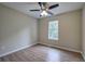 Bedroom with a ceiling fan, window and light wood flooring at 70 Ashbury Ct, Dallas, GA 30157