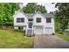 Charming two-story home with a well-manicured lawn and two-car garage at 70 Ashbury Ct, Dallas, GA 30157