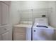 Laundry room features a washer and dryer with a shelf above at 70 Ashbury Ct, Dallas, GA 30157