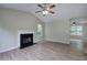 Open living room with fireplace, window, and wood-look floors at 70 Ashbury Ct, Dallas, GA 30157