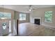 Open living room with wood-look floors, fireplace, and lots of light at 70 Ashbury Ct, Dallas, GA 30157