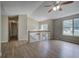 Open living room with wood-look floors and staircase at 70 Ashbury Ct, Dallas, GA 30157
