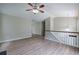 Open living room with wood-look floors and vaulted ceiling at 70 Ashbury Ct, Dallas, GA 30157