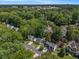 Aerial view featuring a residential neighborhood with tree-lined streets and stunning skyline views at 1175 Haven Brook Ne Way, Brookhaven, GA 30319