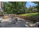 Backyard patio with a fire pit and wooden deck offers ample seating and outdoor enjoyment at 1175 Haven Brook Ne Way, Brookhaven, GA 30319