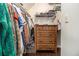 Organized walk-in closet with shelving and a dresser for optimal storage at 1175 Haven Brook Ne Way, Brookhaven, GA 30319