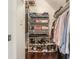 Well-organized walk-in closet featuring shelving, hanging space, and shoe racks at 1175 Haven Brook Ne Way, Brookhaven, GA 30319