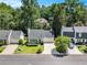 Charming home with manicured front lawn, mature trees, and attached two-car garage at 1175 Haven Brook Ne Way, Brookhaven, GA 30319