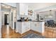 Well-designed kitchen with white cabinets, black countertops, and an adjacent dining area at 1175 Haven Brook Ne Way, Brookhaven, GA 30319