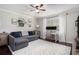 Cozy living room with a large window, stylish decor, and hardwood floors at 1175 Haven Brook Ne Way, Brookhaven, GA 30319