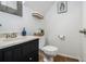 Neat powder room featuring a dark vanity, updated fixtures, and neutral wall decor at 1175 Haven Brook Ne Way, Brookhaven, GA 30319